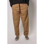 "The Original Limpies" baggy skate pant in beige. These classic baggy pants respect the volume of the 90s, offering the most comfortable vintage skate fit. Made in USA.