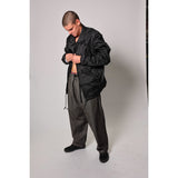 "Carp Skate Pant" in black denim with contrast stitching, retro workwear style. 90s streetwear durability with the loose fit demanded by authentic workwear skate pants. Made in USA.