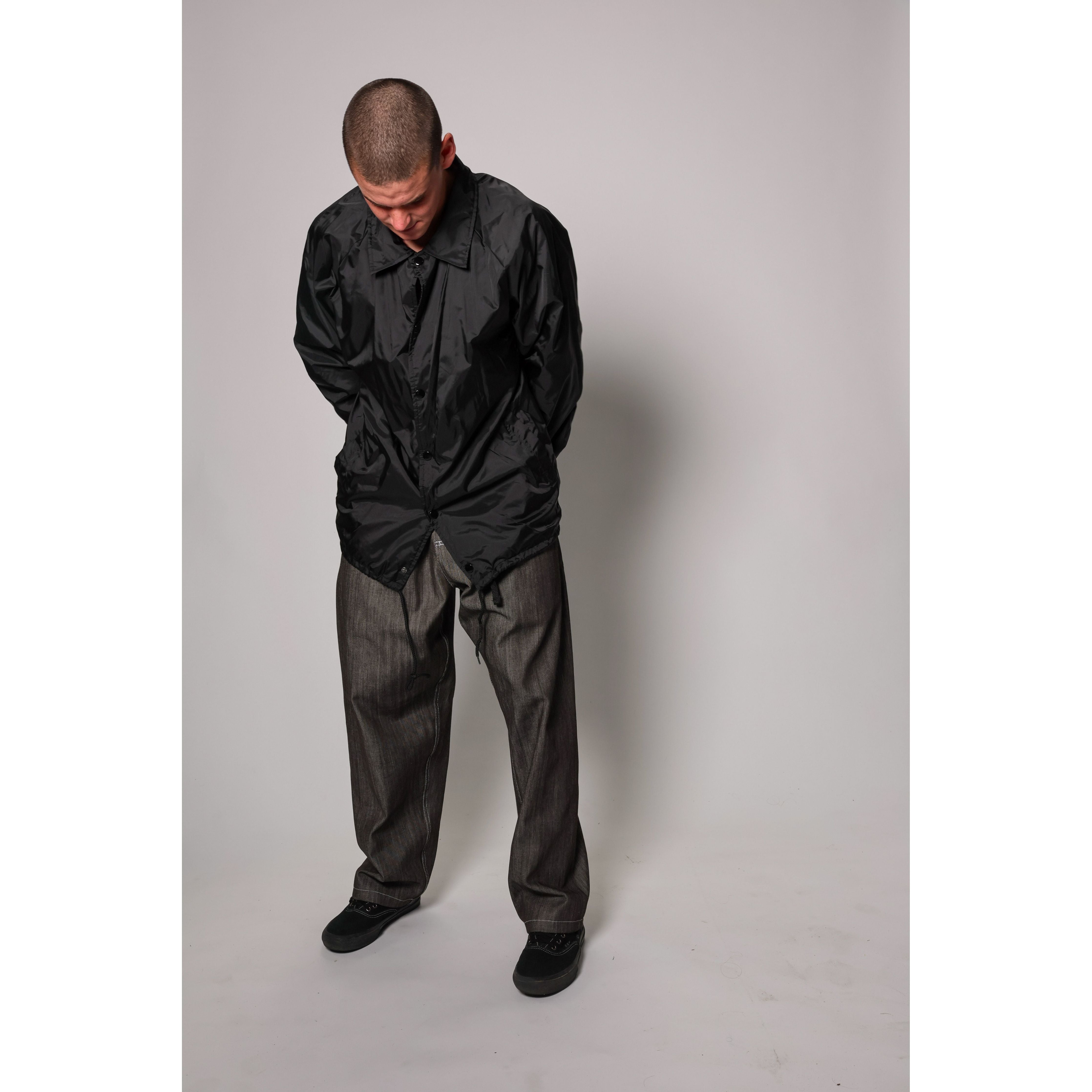 "Carp Skate Pant" in black denim with contrast stitching, retro workwear style. 90s streetwear durability with the loose fit demanded by authentic workwear skate pants. Made in USA.