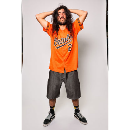 "Over the Knee" skate shorts in black denim with contrast stitching. Workwear style shorts with the wide cut and resilience of 90s denim skatewear for the asphalt. Made in USA.