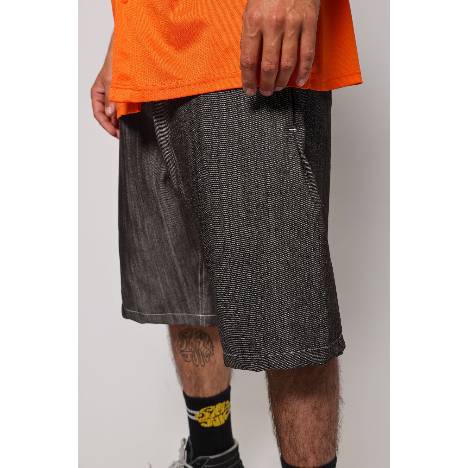 "Over the Knee" skate shorts in black denim with contrast stitching. Workwear style shorts with the wide cut and resilience of 90s denim skatewear for the asphalt. Made in USA.