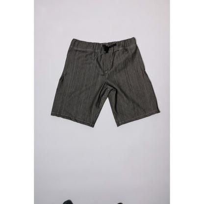 "Over the Knee" skate shorts in black denim with contrast stitching. Workwear style shorts with the wide cut and resilience of 90s denim skatewear for the asphalt. Made in USA.