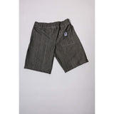 "Over the Knee" skate shorts in black denim with contrast stitching. Workwear style shorts with the wide cut and resilience of 90s denim skatewear for the asphalt. Made in USA.