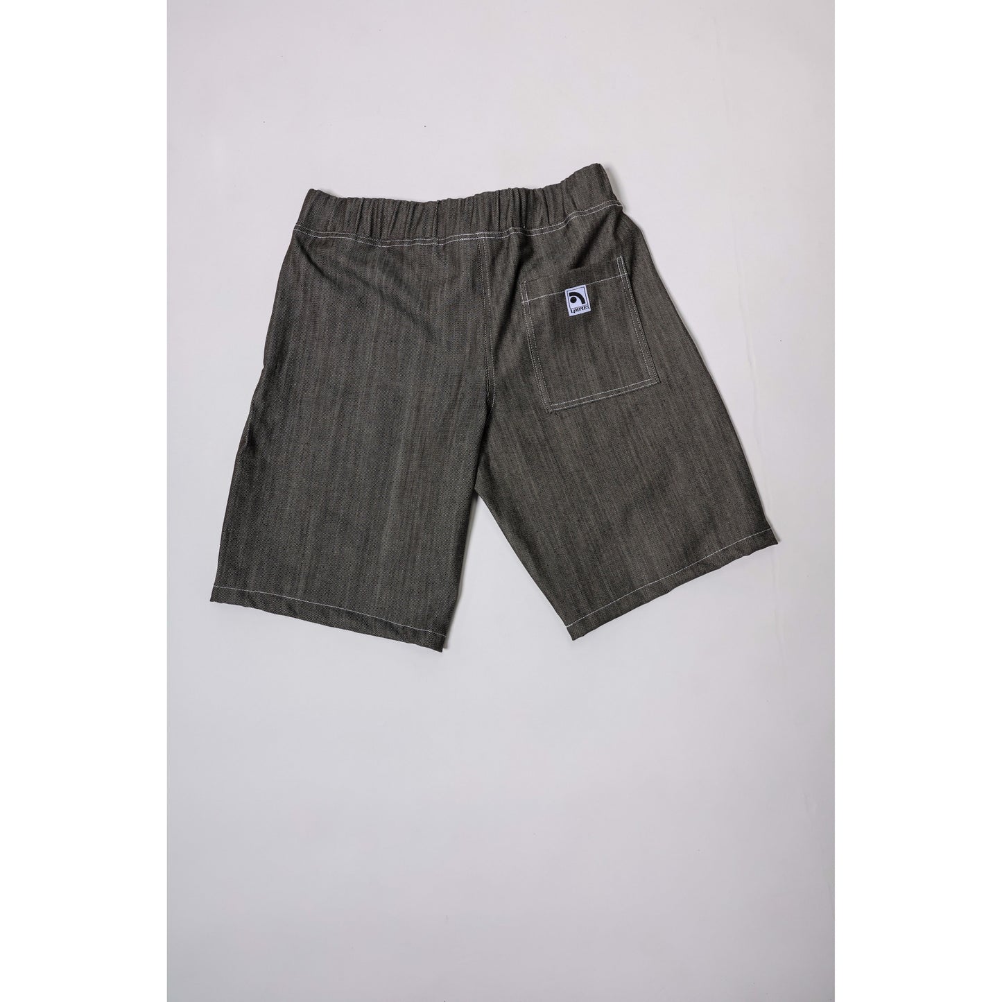 "Over the Knee" skate shorts in black denim with contrast stitching. Workwear style shorts with the wide cut and resilience of 90s denim skatewear for the asphalt. Made in USA.