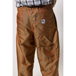 Baggy skate pants in burgundy with a gold stripe. These retro striped skate pants offer a bold 90s street style and a perfect baggy fit for the streets. Made in USA.