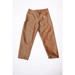 Baggy skate pants in burgundy with a gold stripe. These retro striped skate pants offer a bold 90s street style and a perfect baggy fit for the streets. Made in USA.