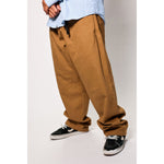 Baggy skate pants in a Camel Lights beige tone. The retro skate trousers with the oversized cut of the 90s, essential for 90s streetwear khaki fans. Made in USA.