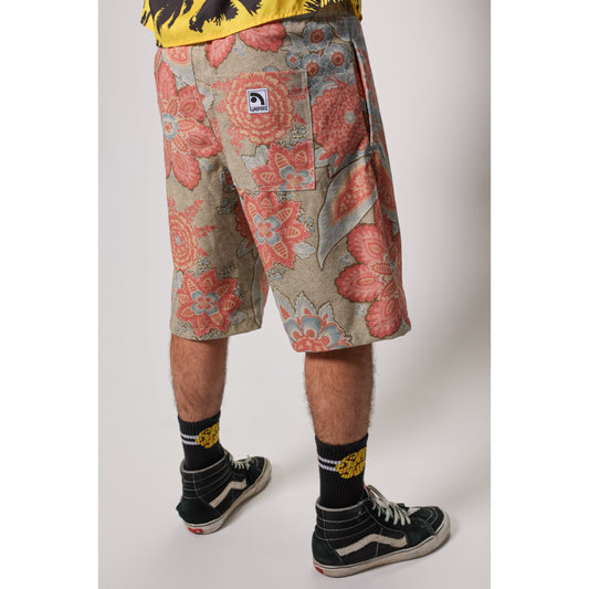 "Over the Knee" skate shorts with a striking Flower Paisley print. Unique vintage pattern shorts that channel the daring retro skate jorts of the 90s decade. Made in USA.