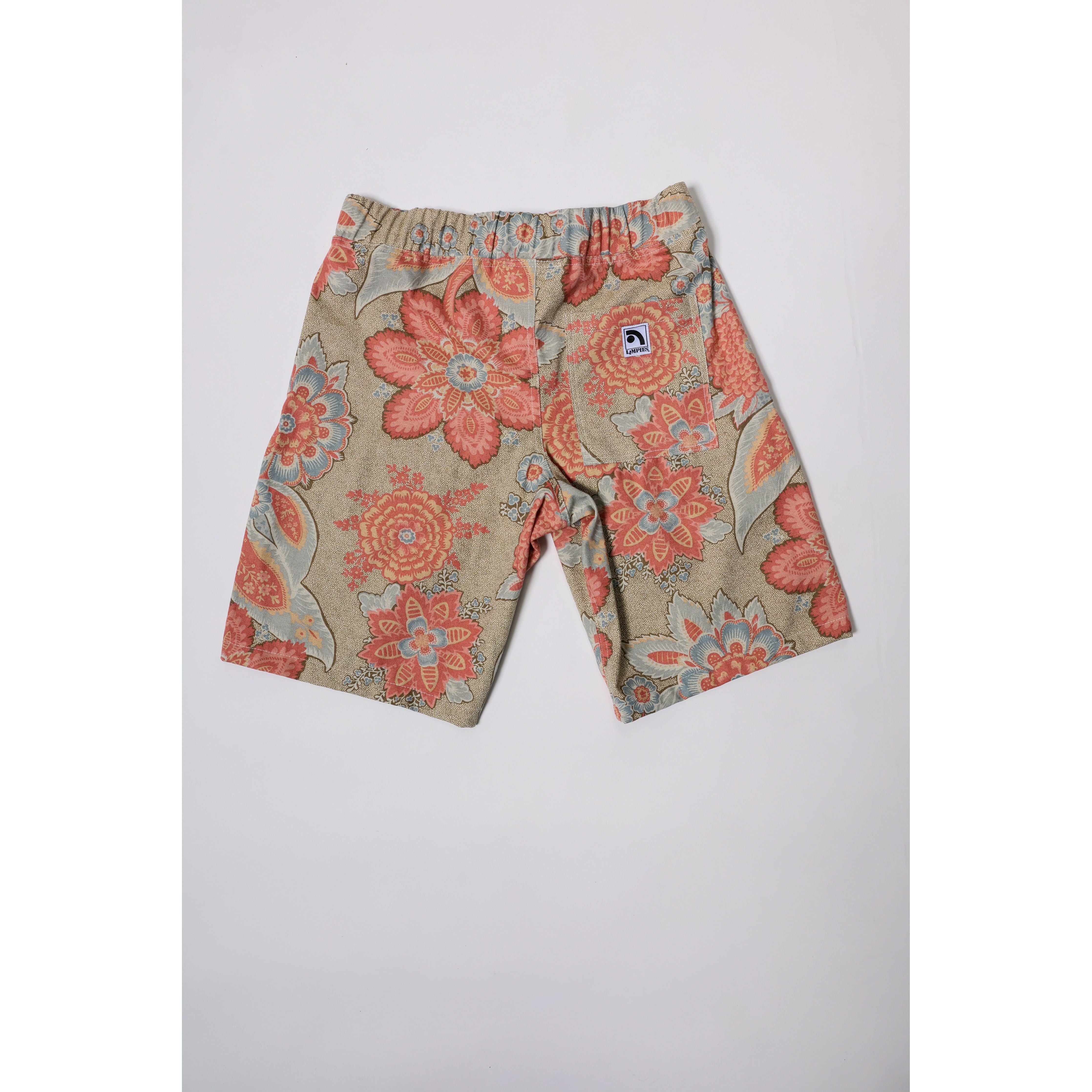 "Over the Knee" skate shorts with a striking Flower Paisley print. Unique vintage pattern shorts that channel the daring retro skate jorts of the 90s decade. Made in USA.