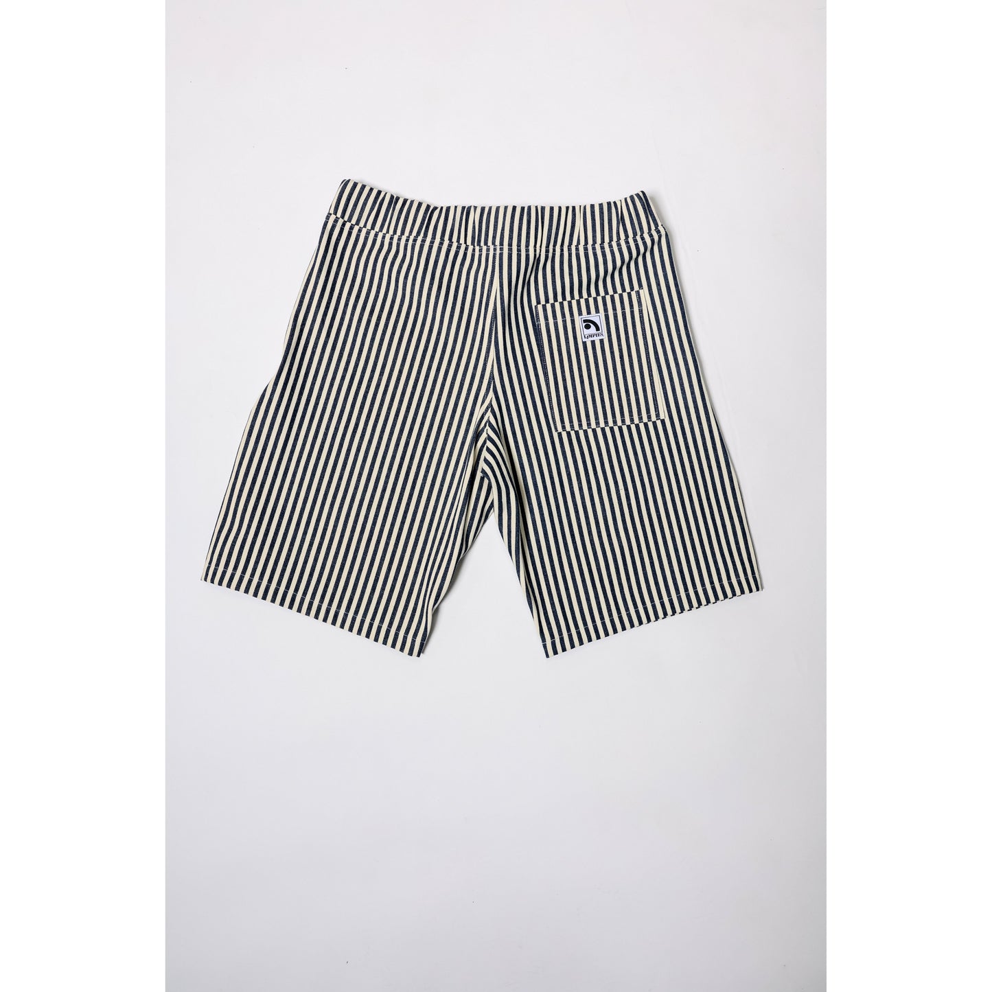 "Over the Knee" skate shorts with a Hickory stripe pattern. The wide cut that recalls retro jorts style and 90s baggy skatewear, maintaining authenticity and urban flow.