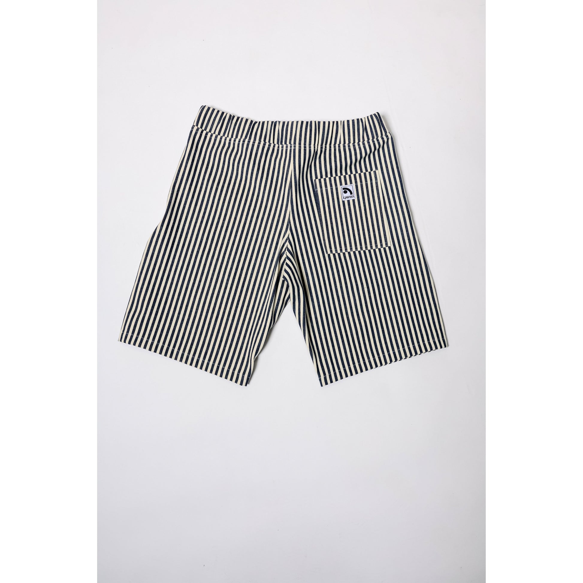 "Over the Knee" skate shorts with a Hickory stripe pattern. The wide cut that recalls retro jorts style and 90s baggy skatewear, maintaining authenticity and urban flow.