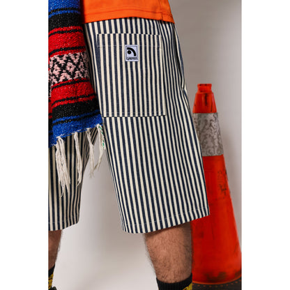 "Over the Knee" skate shorts with a Hickory stripe pattern. The wide cut that recalls retro jorts style and 90s baggy skatewear, maintaining authenticity and urban flow.