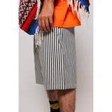 "Over the Knee" skate shorts with a Hickory stripe pattern. The wide cut that recalls retro jorts style and 90s baggy skatewear, maintaining authenticity and urban flow.