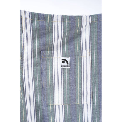 Close-up of a striped garment, likely a shirt or jacket, featuring vertical stripes in muted blue, sage green, and white. A front pocket with a square white brand patch reading 'Limpies' is visible.