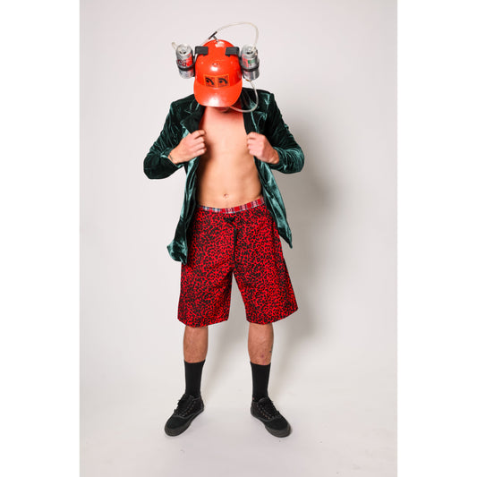 "Over the Knee" skate shorts with a red and black cheetah print. A 90s streetwear print that screams attitude, with the perfect baggy fit for the baggy skate shorts of the era. Made in USA.