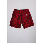 "Over the Knee" skate shorts with a red and black cheetah print. A 90s streetwear print that screams attitude, with the perfect baggy fit for the baggy skate shorts of the era. Made in USA.