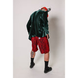 "Over the Knee" skate shorts with a red and black cheetah print. A 90s streetwear print that screams attitude, with the perfect baggy fit for the baggy skate shorts of the era. Made in USA.