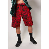 "Over the Knee" skate shorts with a red and black cheetah print. A 90s streetwear print that screams attitude, with the perfect baggy fit for the baggy skate shorts of the era. Made in USA.
