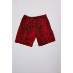 "Over the Knee" skate shorts with a red and black cheetah print. A 90s streetwear print that screams attitude, with the perfect baggy fit for the baggy skate shorts of the era. Made in USA.