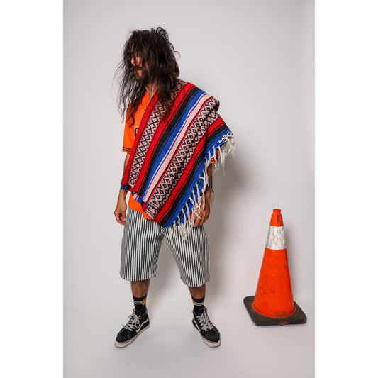 "Over the Knee" skate shorts with a Hickory stripe pattern. The wide cut that recalls retro jorts style and 90s baggy skatewear, maintaining authenticity and urban flow.